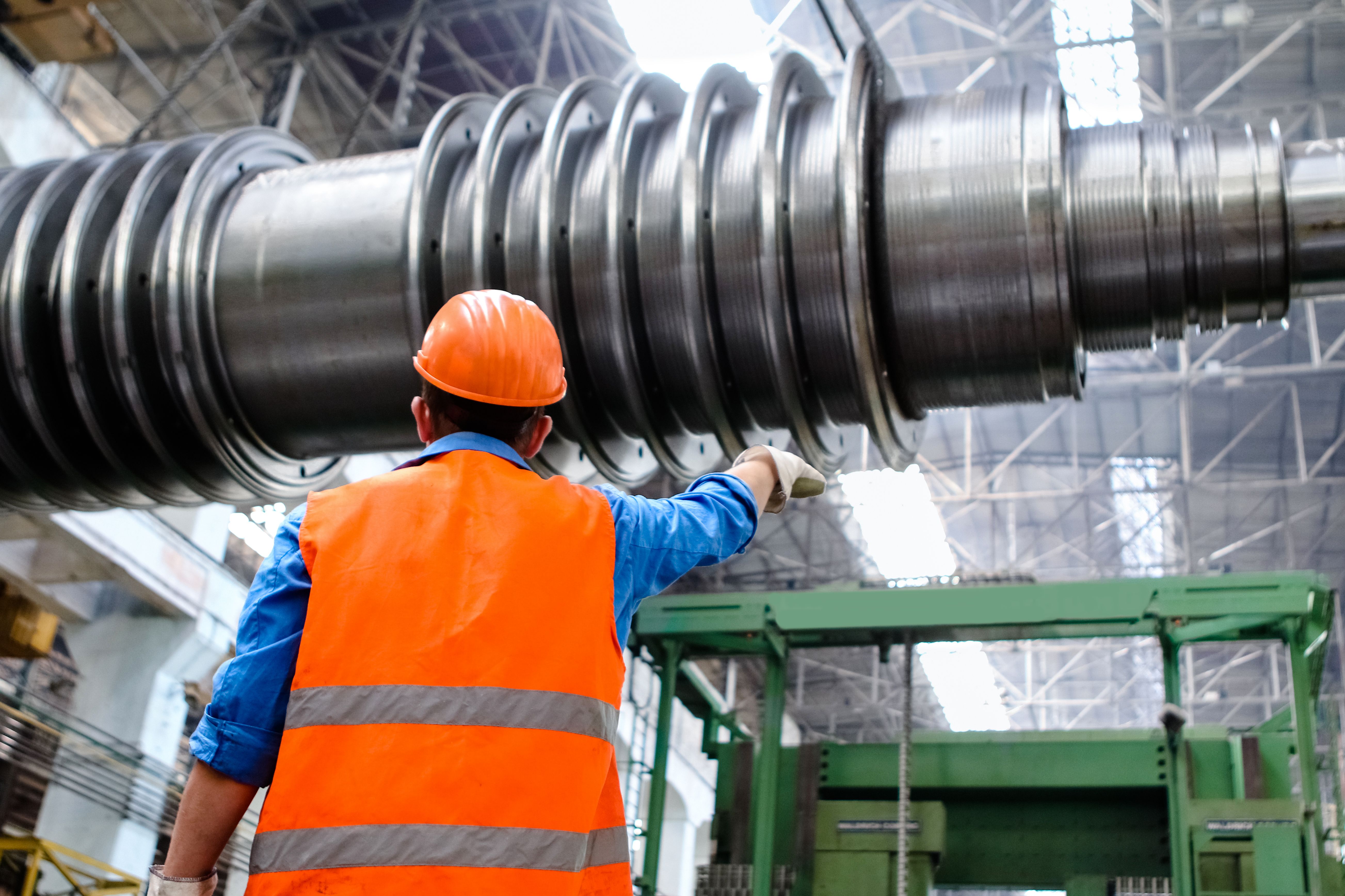 Engineer inspecting a precision-machined component