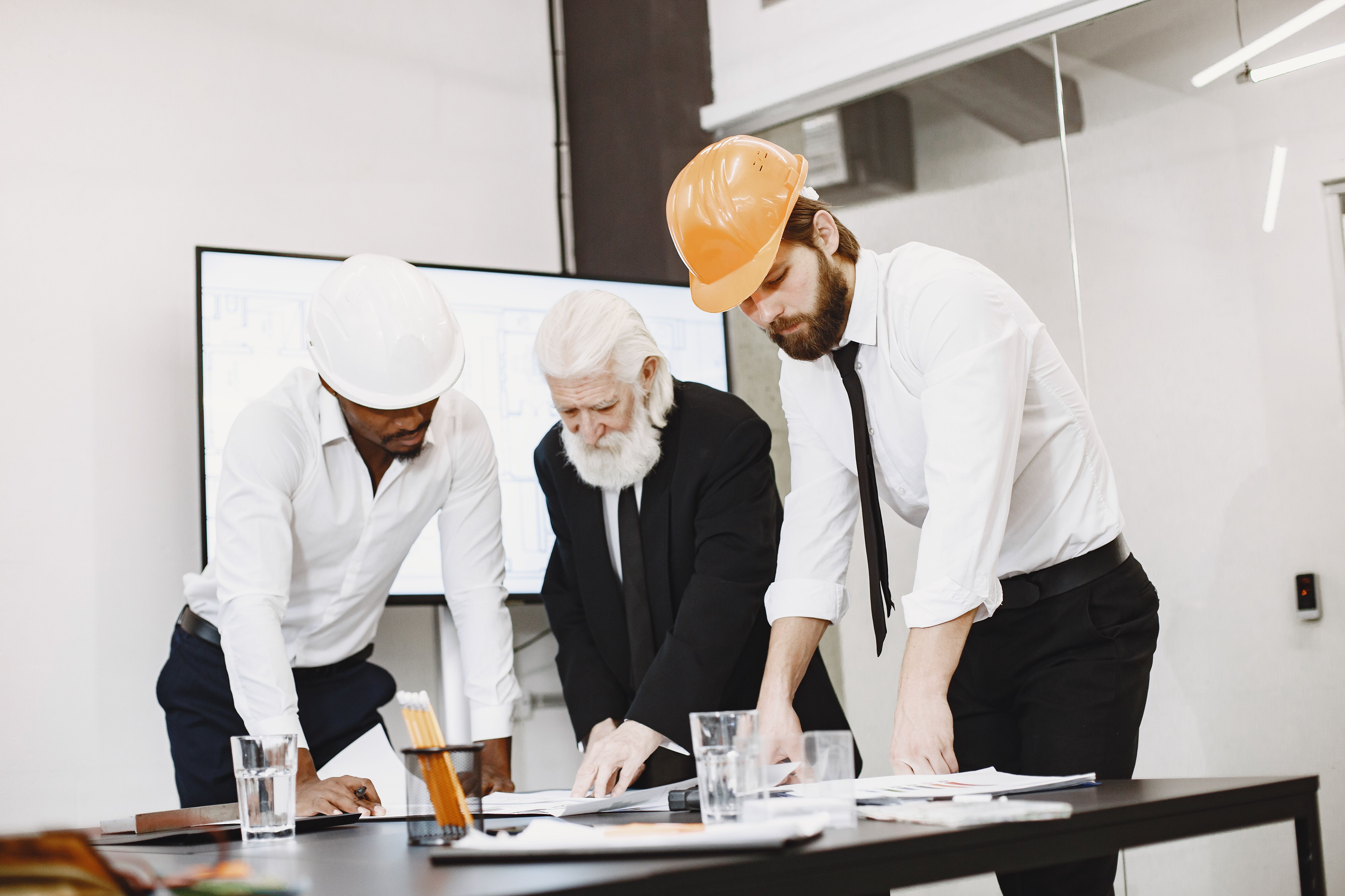 Project team reviewing plans in a program review meeting